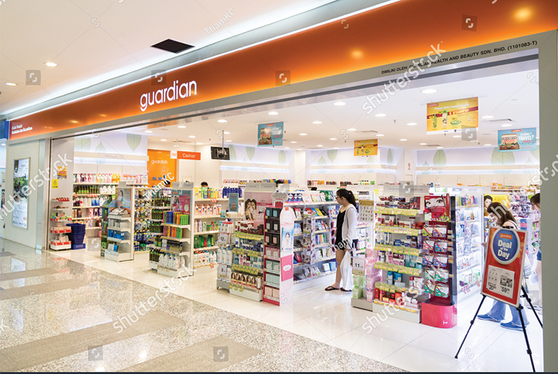 The entrance to a well-lit pharmacy